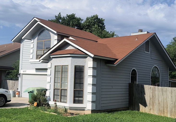 Offerings Red Brown Roof Gray Siding BLue Sky Colorful